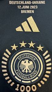  - Original match issued DFB jersey with the number 24, worn by Florian Wirtz. Prepared for the international match against Ukraine on June 12, 2021, in Bremen. The DFB eagle on the jersey features a design created especially for the 1000th international match of the German national team. Condition: AAC; short-sleeved jersey; size L; DFB eagle and Adidas logo embroidered; player number and name rubberized, "We are here for you" patch and peace patch rubberized; 100% polyester; made in China; condition A. Condition: A - Bild 4