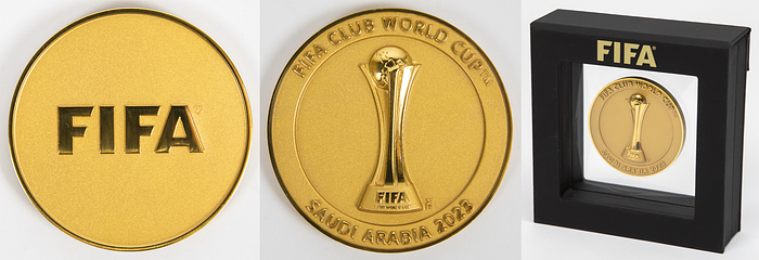  - "FIFA Club World Cup Qatar 2023." Official participation medal for coaches, officials, and players of the 2023 FIFA Club World Cup in UAE (United Arab Emirates), won by Manchester City. Bronze, gold-plated, 5.0 cm. In the original case. --Very rare. Very nice EF! The final was played on December 22, 2023, between Fluminense Rio de Janeiro and Manchester City (0-4). Condition: A