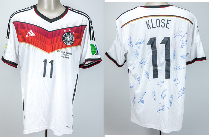  - Original, authentic Adidas Germany fan jersey – 2014 FIFA World Cup. Features the back number "11" of Miroslav Klose. Includes the match print from the Final: "Germany v Argentina, July 13, 2014, Rio de Janeiro." Bears a total of 22 original autographs from the players and coaching staff of the 2014 World Champions, Germany: Neuer, Lahm, Boateng, Hummels, Höwedes, Kramer, Schürrle, Schweinsteiger, T. Müller, Kroos, Özil, Mertesacker, Klose, Götze, Podolski, Draxler, Mustafi, Löw, Flick, Köpke, and Bierhoff. --Short-sleeve, Made in Thailand, Date of manufacture: 3/14, adidas adizero, Size L. Autograph obtained in person. Condition: A