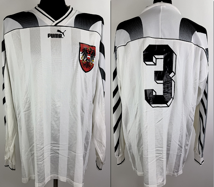  - Original match-worn Austria player shirt, number 3 (Peter Schöttel). Worn during the international match against Switzerland on March 10, 1999, in St. Gallen. This jersey comes from the collection of Swiss international player David Sesa. It is a match-swapped jersey. Status AAA; long-sleeved shirt; size XL; stitched federation crest; flocked Puma logo; rubberized player number; 100% polyester; made in Hungary. Condition: A