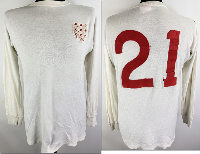 match issued football shirt england 1971 - Original match-issued England player shirt (number 21), prepared for the international match against Switzerland on October 13, 1971. The shirt comes from the collection of Karl Odermatt and was previously an exhibit in a Swiss sports museum. Status: ABB. Shirt details: long-sleeved; size L; manufacturer Umbro;sewn-on association crest and back number; 100% cotton. Condition: A-