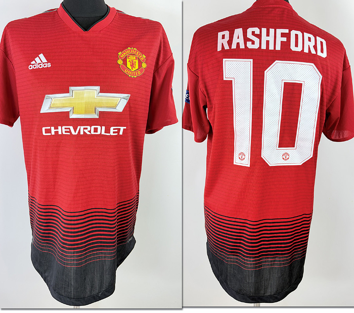  - Original match-issued Manchester United player shirt, number 10 (Marcus Rashford). Prepared for the Champions League quarter-final first leg on April 10, 2019. Status AAC. Short-sleeved shirt; size 8; club crest and Adidas logo applied; sponsor, club name, player number, and player name heat-pressed; Champions League and Respect patches applied (flock finish); 100% polyester; made in Cambodia. Condition: A