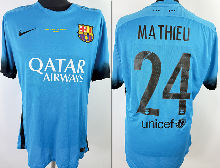  - Original match-issue FC Barcelona player shirt, number 24 (Jérémy Mathieu). Prepared for a 2015 Club World Cup match. Condition: ABC. Short-sleeved shirt; size XL; club crest and manufacturer logo applied; chest sponsor, player name, and number heat-applied; Club World Cup logo and match details heat-applied; 100% polyester; made in Thailand. Condition: A