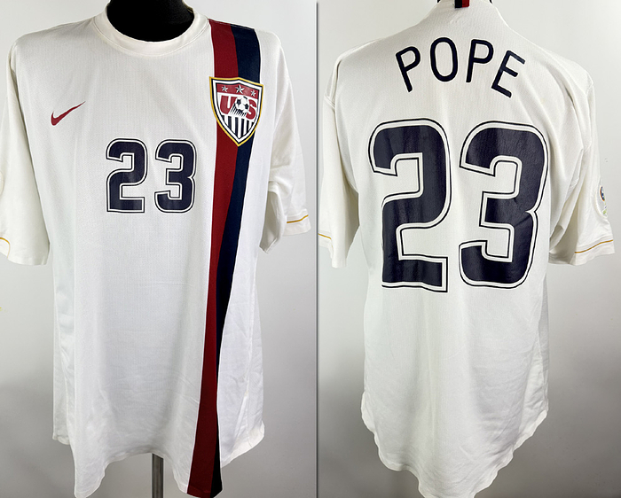  - Original match-issued USA player jersey, number 23. Prepared for George Edward "Eddie" Pope for a match during the 2006 World Cup in Germany. The jersey comes from the collection of a former DFB employee. Status:ABB. Short-sleeved jersey; size XXL; federation logo and Nike manufacturer logo applied as rubberized transfers; player number and name applied as rubberized transfers; "World Cup 2006" detail applied via flocking; 100% polyester; made in Morocco. Condition: A
