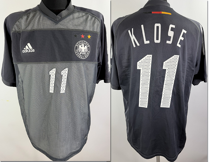  - Original match-issued DFB player shirt, number 11 (Miroslav Klose). Prepared for a 2002 World Cup match; the away shirt was not used during the tournament. The shirt comes from the collection of a former DFB staff member. Status:ABB. Short-sleeved shirt; size XL; heat-applied DFB logo and Adidas manufacturer logo; heat-applied player number and name; heat-applied 2002 World Cup patch; Adidas Climacool with integrated inner shirt; 100% polyester; made in Tunisia.  Abrasion on the Adidas stripes on the shoulder Condition: B
