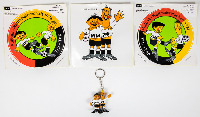  - World Cup 1974: Three large stickers featuring Tip and Tap, the official mascots of the 1974 World Cup. Unused, 16 x 16 cm each. Also included: a plastic Tip and Tap keychain, 6 cm high. Condition: A-