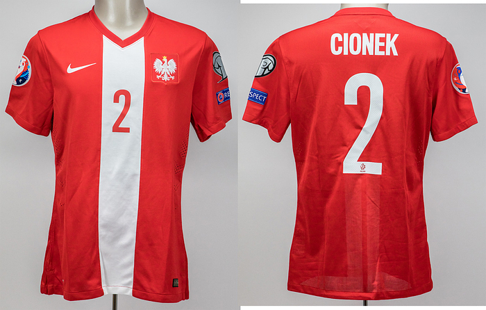  - Original match-issued Poland player shirt with squad number 2. Worn by Cionek (who did not come off the bench) on September 4, 2015, in the UEFA Euro 2016 qualifier against Germany (1–3). Status: AAB. --Short-sleeved jersey; size L; sewn-on federation emblem; embroidered Nike lettering; player name and squad number (front and back) applied in rubberized print; laser-cut ventilation holes; Nike Dri-Fit (embroidered). --The consignor obtained this jersey directly from a former DFB team staff member. Condition: A