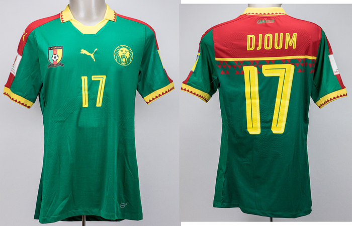  - Original match-worn/issued Cameroon player shirt with squad number 17. Worn by Djoum on June 25, 2017, in the 2017 Confederations Cup match against Germany (1–3) in Russia. Status: AAB. Short-sleeved jersey; size XL; rubberized association logo, Puma logo, and lion's head logo; rubberized player name and squad number (front and back); jersey features rubber reinforcements in the back area; includes FIFA Confederations Cup 2017 patch and FIFA Fair Play patch; Puma PowerCell technology. --The consignor obtained this jersey directly from a former DFB team staff member. Condition: A