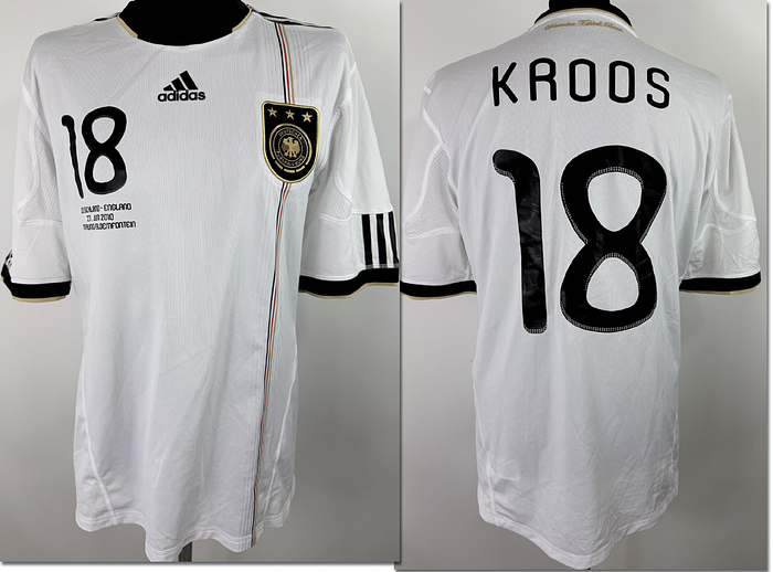  - Original match worn / issued DFB player shirt, number 18 (Toni Kroos). Worn / Prepared for the 2010 World Cup Round of 16 match between Germany and England on June 27, 2010, in Mangaung, South Africa—a game the German national team won 4–2. Status AAC. Short-sleeved shirt; size L; DFB logo applied (adhesive); Adidas manufacturer logo, match details, player number, and player name applied (rubberized/heat-pressed); 2010 World Cup patch applied (flock); Adidas Formotion technology; 100% polyester; made in Thailand. Condition: A