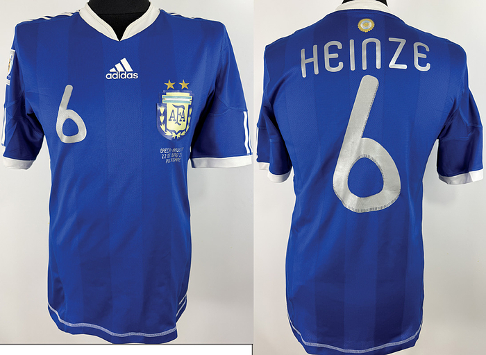  - Original match worn / issued Argentina player shirt, number 6 (Gabriel Heinze). Worn / Prepared for the 2010 World Cup match against Greece on June 22, 2010, in Polokwane, South Africa. Short-sleeved shirt; size M; Argentina crest and Adidas logo applied as rubberized transfers; match details, player number, and player name applied as rubberized transfers; 2010 World Cup patch applied as a flock transfer; Adidas Formotion; 100% polyester; made in Thailand; condition A; status AAB. Condition: B