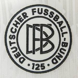 2025 match worn football shirt Germany Musiala - Original match-worn/issued Germany shirt with the number 10. Worn by Jamal Musiala in the UEFA Nations League semi-final between Italy and Germany (1:2) on March 20, 2025 in Milan. This special shirt commemorates 125 years of the German Football Association. Status: AAB. This shirt was only worn in the two matches against Italy (March 20 and 23, 2025)! (probably caused by strong pulling on the shirt by an Italian player).---Short-sleeved jersey; size M; DFB special patch "125 German Football Association" (embroidered and sewn), embroidered adidas logo; rubberized player name and number (front and back); embroidered German flag in the collar; jersey with UEFA Nations League patch and UEFA Foundation for Children "10 Years" patch; adidas Aeroready. And sewn-on white adidas shield with embroidered adidas logo, DFB logo, and "Founded 28.01.1900" lettering. Jersey comes from a DFB employee.--The German Football Association is celebrating ist 125th anniversary this year and has launched a special jersey for the occasion: the DFB Anniversary Jersey 125 Years. This jersey combines the legacy of all previous Germany jerseys and is a tribute to the long history of German football. The DFB Anniversary Jersey 125 Years is characterized by a classic and understated design. The main color is cream white, combined with a black collar and black cuffs. The historical elements are particularly striking. The jersey features the Adidas Trefoil logo, reminiscent of earlier designs. The first DFB logo from 1900 has also been incorporated in a special 125th anniversary version. An embossed eagle is incorporated behind the classic crest as a symbol of German football tradition. The German flag is a subtle detail on the inside of the back collar. A museum piece! Condition: A- - Bild 8