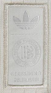 2025 match worn football shirt Germany Musiala - Original match-worn/issued Germany shirt with the number 10. Worn by Jamal Musiala in the UEFA Nations League semi-final between Italy and Germany (1:2) on March 20, 2025 in Milan. This special shirt commemorates 125 years of the German Football Association. Status: AAB. This shirt was only worn in the two matches against Italy (March 20 and 23, 2025)! (probably caused by strong pulling on the shirt by an Italian player).---Short-sleeved jersey; size M; DFB special patch "125 German Football Association" (embroidered and sewn), embroidered adidas logo; rubberized player name and number (front and back); embroidered German flag in the collar; jersey with UEFA Nations League patch and UEFA Foundation for Children "10 Years" patch; adidas Aeroready. And sewn-on white adidas shield with embroidered adidas logo, DFB logo, and "Founded 28.01.1900" lettering. Jersey comes from a DFB employee.--The German Football Association is celebrating ist 125th anniversary this year and has launched a special jersey for the occasion: the DFB Anniversary Jersey 125 Years. This jersey combines the legacy of all previous Germany jerseys and is a tribute to the long history of German football. The DFB Anniversary Jersey 125 Years is characterized by a classic and understated design. The main color is cream white, combined with a black collar and black cuffs. The historical elements are particularly striking. The jersey features the Adidas Trefoil logo, reminiscent of earlier designs. The first DFB logo from 1900 has also been incorporated in a special 125th anniversary version. An embossed eagle is incorporated behind the classic crest as a symbol of German football tradition. The German flag is a subtle detail on the inside of the back collar. A museum piece! Condition: A- - Bild 13