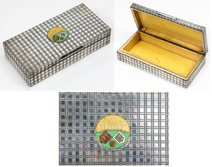 Football Match England v Germany 1966 Silverbox - Silver box from the estate of the German national coach Helmut Schön. Gift from the English Football Association on the occasion of the international football match at Wembley Stadiumon on 23 February 1966; England vs Germany (1:0). Silver casket in 1960s design with wooden insert. With mounted, coloured enamelled plaque (3.7 cm) made bronze, gilt with the emblems of the English and German FA and a silhouette of Wembley Stadium, 18.5x9x4 cm. Box was acquired at the church flea market in 1998, where large parts of Helmut Schön's collection were sold! Condition: A