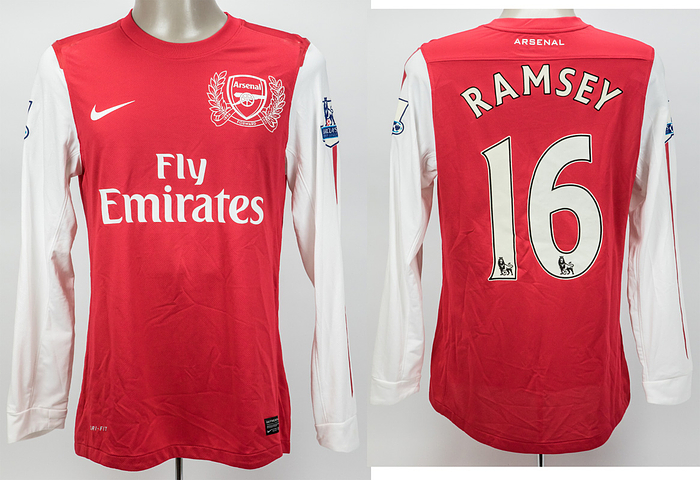Original match worn Spielertrikot FC Arsenal mit der Rückennummer 16. Getragen von Aaron Ramsey in einem Spiel der englischen Premier League  in der Saison 2011/2012. Ramsey ist 83-facher Nationalspieler von Wales. Mit original COA von Your Heroes & Legends Limited. Status:ABC.