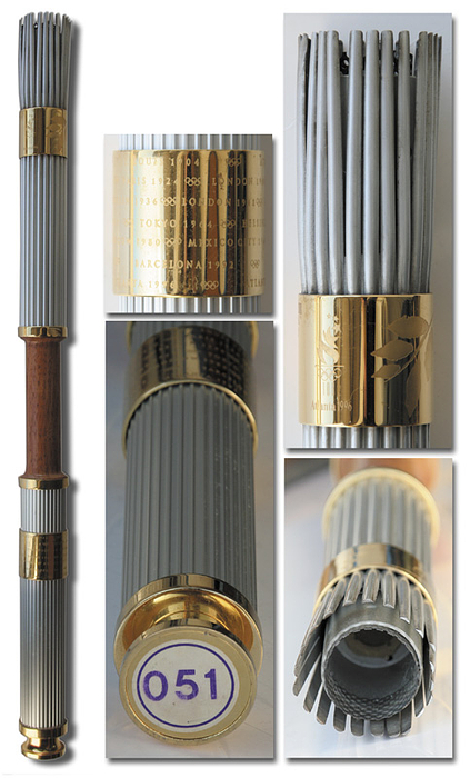 Olympiafackel 1996  | Original Olympiafackel der Olympischen Sommerspiele Atlanta 1996, . Aluminium und Holz, vergoldetes Kupfer, Höhe 80 cm. Entwurf von Peter Mastrogiannis.