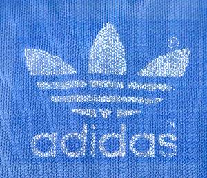 match worn football suit Stuttgarter Kickers 70s - Original match worn training jacket from the Stuttgarter Kickers worn by Werner Weist in the 2nd Bundesliga in the 1977/1978 season. Status: ABA. --Adidas jacket (52% cotton / 48% polyamide); size 5; Adidas logo applied using the wet flocking process; jacket has been washed several times! --Jersey comes directly from the Werner Weist collection (1949-2019) - Borussia Dortmund 1968 - 1971 (72/34), Werder Bremen 1971-1977 (145/33), Stuttgarter Kickers (1977-1978; 10/1); 3x DFB U-23 1970 + 1971). The buyer receives a certificate of authenticity and confirmation from the Weist family regarding the origin of the items. Condition: A-B - Bild 4