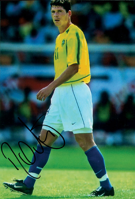 Farbreprofoto mit original Signatur von Ânderson Corrêa Polga (11 Länderspiele). Weltmeister mit Brasilien bei der Fußball Weltmeisterschaft 2002, 15x10 cm.