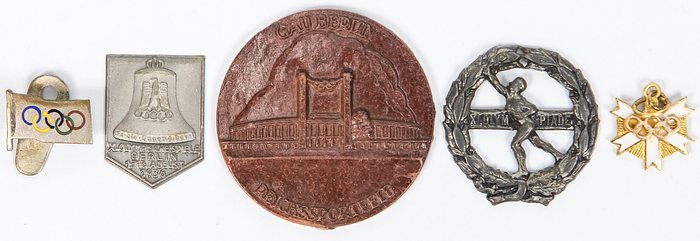  - Berlin Olympic Games 1936. Collection of small badges relating to the 1936 Olympics, made of various materials. 4 cm to 1.5 cm Condition: A-B