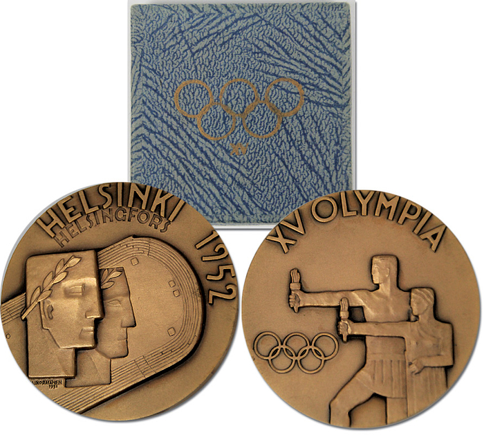 Olympic Games 1952. Participation Medal Helsinki - Bronze, size 5.4 cm,  with relief Olympic Rings and motifs, in original card box. EF. Box in blue colour Condition: A