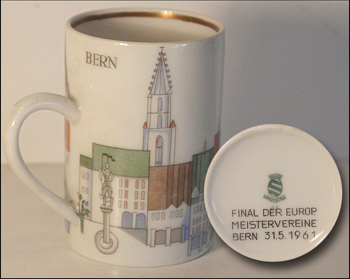  - Four-color printed mocha cup "Bern" with the city skyline of Bern and the inscription on the bottom "Finale der Europ. Meistervereine 31.5.1961" (Final of the European Championship Clubs 31.5.1961). Manufacturer "Suisse Langenthal". Porcelain, height: 6.5 cm. Guttmann Estate 2001 No. 228 --A gift from the host city of Bern to the players, coaches and officials of the teams of the memorable European Cup final "Real Madrid - Benfica Lisbon", which Benfica won 5:3 and thus broke Real Madrid's supremacy in Europe. Condition: A