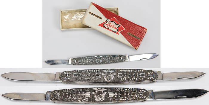  - Chrome-plated pocket knife commemorating Benfica Lisbon's two European Cup triumphs. Both sides of the knife bear inscriptions and the Benfica club logo: "1961/1962 Campeao Europeu Benfica - Real Madrid 5-3" 2) "1960/1961 Capeao Europeu Benfica - Barcelona 3-2". 8.5 x 1.8 cm. In original cardboard box -- -Guttmann Estate 2001 No. 261 Condition: A