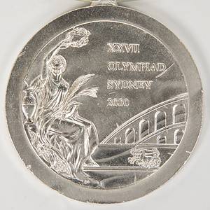  - Olympic Games Sydney 2000 Silver Winner Medal: Winner medal for the Baseball runner-up champion Cuba, second at the Olympic Games in Sydney 2000. Silver, engraved "Baseball" plus original silk ribbon which is embroidered, 6.8 cm. signs of wear, two small dents on edge. They occured at the party held by the Cuban Basball players after the award ceremony in Sydney. Silk ribbon loose Condition: A- - Bild 2