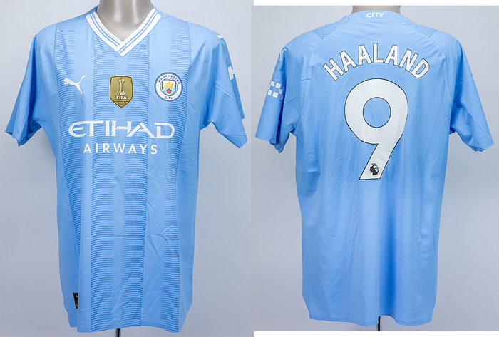  - Original match-worn Manchester City shirt with the number 9. Worn by Erling Haaland in an English Premier League match during the 2023/2024 season. Haaland has been capped 43 times by Norway. The shirt features the Intercontinental Cup winners badge. Status: ABC  --Short-sleeved jersey; size XL; club emblem and FIFA World Champions 2023 badge. Rubberized Puma logos; rubberized 'Eti-Had Airways' advertising print; rubberized back number and player name; rubberized 'City' lettering on the back of the collar; with Premier League logo patch and No Room for Racism patch; Puma UltraWeave. Condition: A