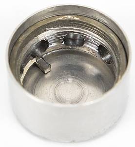 Olympic Games Innsbruck 1976. Official Torch - Original torch from the Olympic relay from Olympia to Innsbruck 1976. Stainless steel and aluminium, manufactured by United Metalworks, Ranshofen-Berndorf AG. Length 74 cm, plate diameter 21 cm. This torch is very rare and one of  less than 100 copies.  --This torch was used in the torch relay for the 1976 Winter Olympics in Vorarlberg. The torch comes from the estate of a high-ranking administrative official from Vorarlberg who worked for sports in this Austrian province from 1967 to 1984. He received this torch as a gift from the manufacturer after the torch relay. The torch has two special features: 1) A plaque bearing the inscription "Ein Geschenk der Vereinigte Metallwerke Ranshofen-Berndorf A.G." was affixed to the handle of the torch by the manufacturer. 2) The manufacturer sealed the torch tip with a screw-on capsule to prevent dirt from accumulating inside the torch. The torch's outlet nozzle was attached to this metal capsule. ---The torch has light speckles of corrosion. Condition: A- - Bild 13