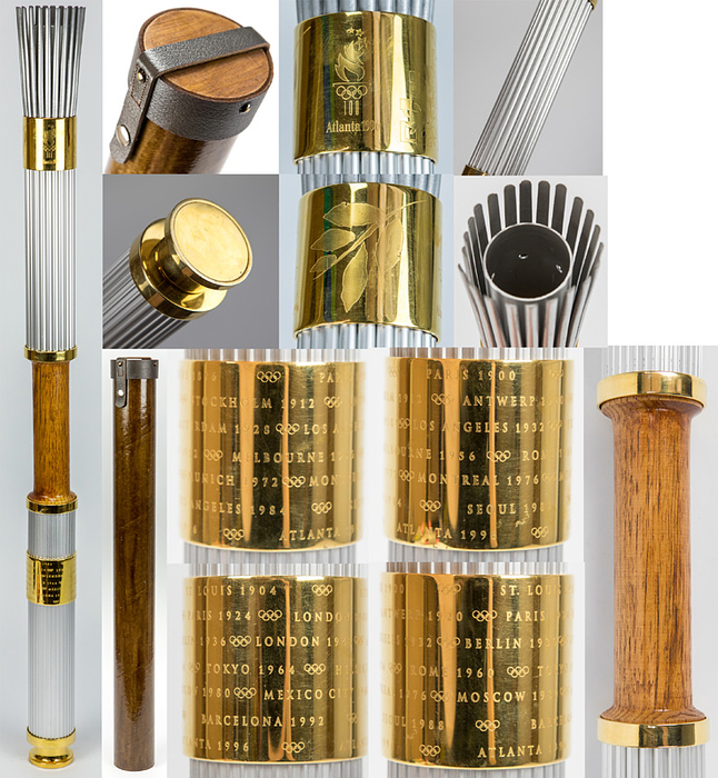 Olympiafackel 1996  | Original Olympiafackel der Olympischen Sommerspiele Atlanta 1996, . Aluminium und Holz, vergoldetes Kupfer, Höhe 80 cm. Entwurf von Peter Mastrogiannis.