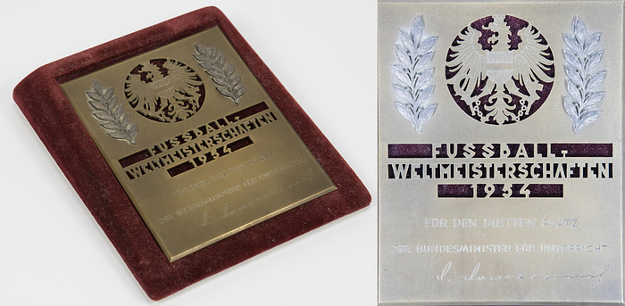  - Official commemorative plaque for the Austrian national team players who finished third at the 1954 FIFA World Cup. With the stamped inscription "1954 FIFA World Cup" and the engraving "For Third Place. The Federal Minister of Education." Bronze with two applied silver-plated laurel leaves, 11.3 x 9 cm. Includes original velvet-covered presentation tray for this plaque. --Only the national team players received them. Very rare! ---Origin: These piece comes from an old collection with a focus on the 1954 Football World Cup Condition: A-