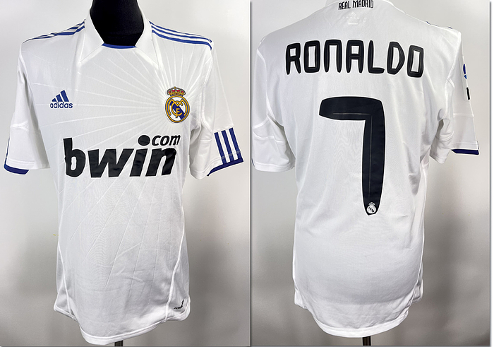  - Original match-worn Real Madrid number 7 shirt worn by Cristiano Ronaldo. Worn in a La Liga match during the 2010/2011 season. Ronaldo won the European Championship with Portugal in 2016 and has won the UEFA Champions League five times. Status: ABC  Short-sleeved shirt; size L; flocked club emblem; rubberized Adidas manufacturer logo, club name, player number, player name, and sponsor 'Bwin'; rubberized La Liga patch; 100% polyester; Made in Vietnam; Adidas-Formotion; StatusABA Condition: A