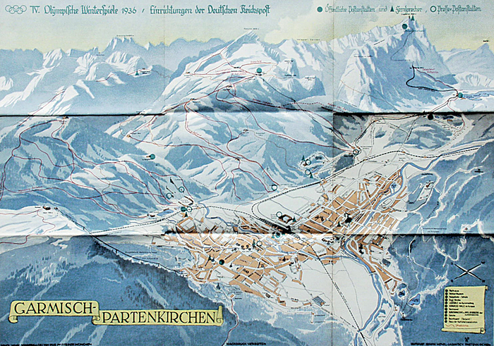 Plakat OSW1936  | Vierfarbiges lithographisches Plakat „IV.Olympische Winterspiele 1936. Einrichtungen der Deutschen Reichspost“ Garmisch aus der Vogelperspektive mit den Olympischen Sportstätten und Fernsprech-und Poststellen. 60x42 cm.