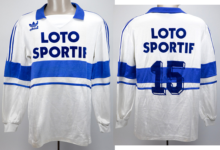  - Original match-worn Olympique Marseille player shirt with the number 15. Worn in the 1988/1989 season. Status: ABA. --Long-sleeved jersey; size 6/7; Adidas logo, sponsor, and back number flocked; Adidas. One pulled thread in the lower back area; minor signs of storage. The consignor received this directly from a German national player who played for Olympique in the 1988/89 season. Condition: A-