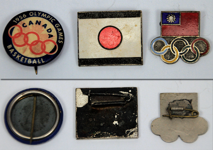  - Three different team badges from the 1956 Melbourne Olympic Games. 1) Republic of China (Taiwan), bronze, silver-plated, colored enamel, 2 x 2.2 cm. 2) Japan with the inscription "XVTth Olympic Games - Japanese Delegation 1956". Bronze, silver-plated, colored enamel, 2.5 x 2 cm. 3) Round badge made of tinplate. Printed with the inscription "Canada 1956 Olympic Games Basketball", 2.3 cm. --The badges were personally collected in Melbourne by German national football player Rudi Hoffmann (1935-2020; 1 international cap) and participant in the Olympic football tournament for Germany at the 1956 Melbourne Olympic Games. Badges directly from Hoffmann's estate. --tarnished Condition: A-