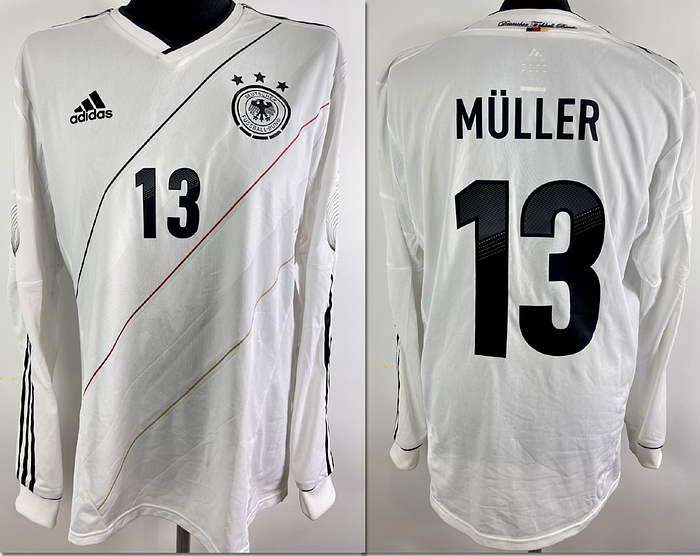  - Original match worn / issued German national team shirt with the number 13 of Thomas Müller. Designed for an international match in 2011/2012. AAA status.  Long-sleeved shirt; size L; club emblem, Adidas manufacturer logo applied; rubberized player number and name; rubberized Jabulani patch; 100% polyester; Made in China. Condition: A