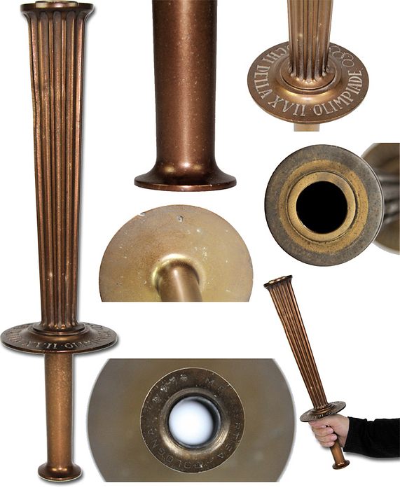 Olympic games Rome 1960. Official Olympic Torch - Olympic Games Rome 1960:0 Official Olympic torch in bronzed aluminium with embossd  lettering "Giochi della XVII Olimpiade" and Olympic rings on the protective plate above the hand grip. Original Torch with signs of usage, otherwise in excellent condition. Height 39.5cm, manufactured by  M.F. Curtisa/Bologna". With signs of wear. Condition: B