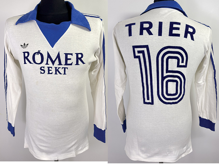  - Original match-worn Eintracht Trier player jersey with the number 16. Worn in a match of the 2nd Bundesliga in the 1978/1979 season. Status: ABB Long-sleeved jersey; size XL, flocked club emblem, chest sponsor, club name and player number; rubberized "Adidas" manufacturer logo; 100% cotton; Made in West Germany; Condition: A