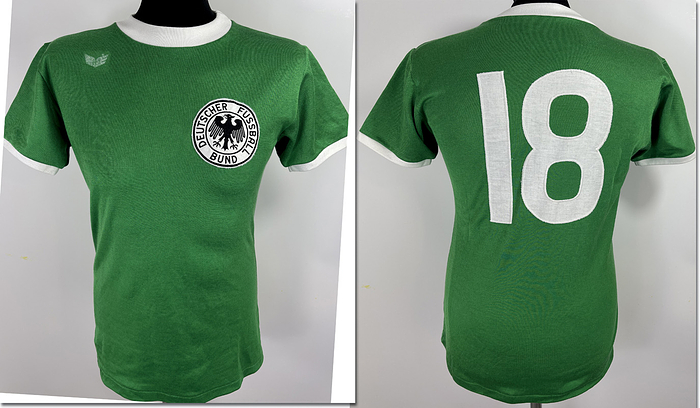 match worn football shirt germany 1977 - Original match-worn DFB player jersey with the number 18, worn by Rüdiger Abramczik. Worn during the 1977 South American tour. The jersey comes from the collection of a former DFB employee. Condition ABB.Short-sleeved jersey; size L; DFB crest sewn on; Erima manufacturer's logo rubberized, player number sewn on, 55% cotton, 45% polyester; Made in West Germany Condition: A