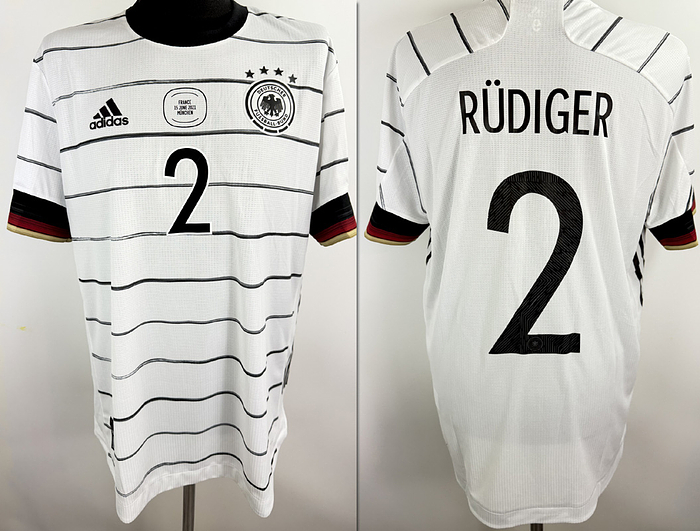 match worn football shirt Germany 2021/2022 - Original match-worn DFB player shirt with the number 2. Worn by Anthony Rüdiger in the European Championship match against Portugal on June 19, 2021, in Munich. The jersey comes from the collection of a former DFB employee. The set consists of shirt and shorts. Condition: AAB. Short-sleeved jersey; size 9; DFB logo, rubberized Adidas logo, match details, rubberized player number and name; flocked European Championship patch and Respect patch; Adidas HEAT.RDY; 100% polyester; made in Cambodia; condition A. Condition: A