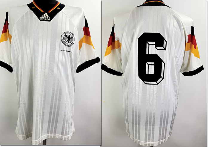  - Original match-worn DFB (German Football Association) player jersey with the number 6, worn by Guido Buchwald. Worn in the international match against Uruguay on December 20, 1992, in Montevideo, Uruguay. The shirt comes from the collection of a former DFB employee. Condition AAB (Class A, Condition AAB). Short-sleeved shirt; size L; DFB logo embroidered by hand; Adidas logo in foam; felt match detail; player number applied using the wet flocking process; Adidas Equipment; 72% polyester, 28% triacetate; Made in Portugal; Condition: A