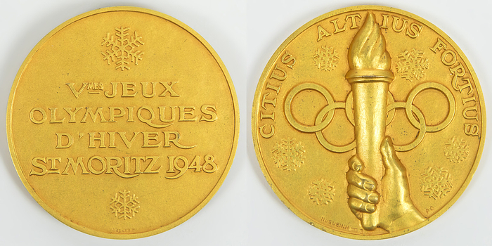  - Gold medal for a first place at the Olympic Winter Games in St. Moritz 1948.  „Vmes Jeux Olympiques d'hiver St.Moritz 1948". Gilt silver, hallmarked (stamped 925, weight: 100 g), Made by Huguenin, 6 cm.   Only 41 gold medals were awarded at the Olympic Games in St. Moritz 1948. Condition: A-