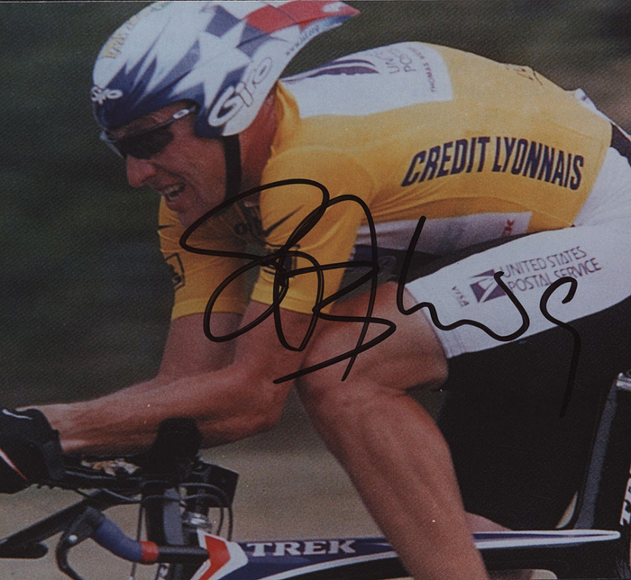  - Tour de France autographed  Lance Armstrong: Colour photo with original signature of the seven time Tour de France champion Lance Armstrong. 17.5 x 12.5 cm. Neat signature with rare dedication! Armstrong was stripped of all his achievements when he was found out to have doped - which clearly was the biggest scandal in cycling history. Condition: A
