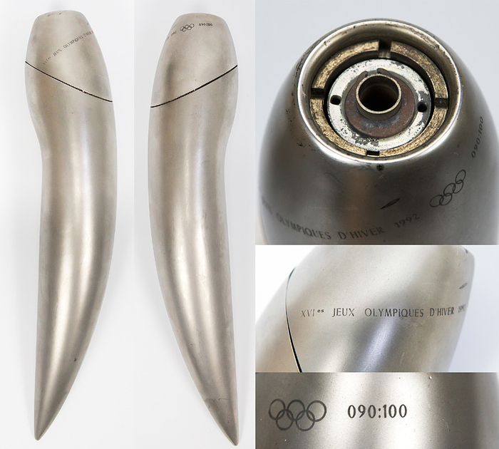  - Original torch of the Olympic Games in Albertville 1992. Matted steel with engraved inscription "XVIe Jeux Olympiques d´Hiver 1992" and Olympic Rings. Engraved number "090:100" (there was a limited edition of 100 copies). 44 cm. Was used in the torch relay. Extraordinary design of French designer Philippe Starck. One of the rarest torches. With minor trace of usage; burner with fire traces from the relay. Condition: A-