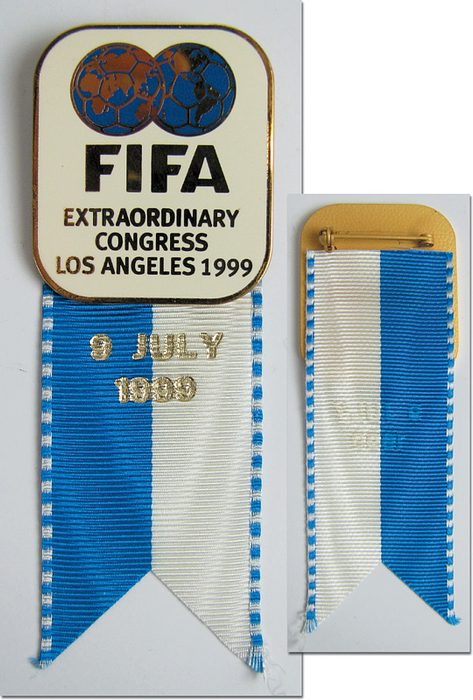  - "FIFA, Extraordinary Congress 1999 in Los Angeles". Bronze, gold plated, with coloured enamelling. Size 8x3.3 cm, very rare badge. Ribbon. Condition: A