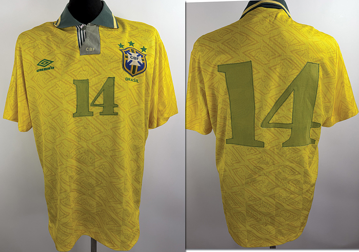  - Original match-worn Brazilian national team jersey, number 14, worn by Cleber. Worn in an international match during the 1993/1994 season. Status: ABC (Austrian Association of Football Players). Short-sleeved jersey; size L; federation crest and Umbro logo applied; player number sewn on; material: polyester; Condition: B