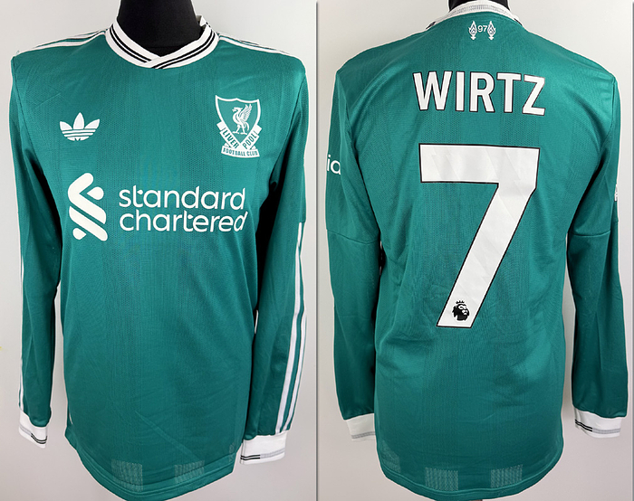  - Original match worn / issued FC Liverpool player shirt with the number 7 of Florian Wirtz. Worn / Prepared for a Premier League match in the 2025/2026 season. Status: ABB. Long-sleeved shirt; size M. Club crest, manufacturer logo "Adidas" applied, sponsor "Standard Chartered", club name, player number and player name rubberized; PL patch "No-room for racism" patch rubberized; sleeve sponsor "Expedia" rubberized; 100% polyester; Made in Vietnam. Condition: A