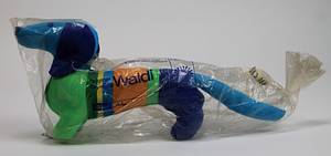  - Olympic Games Munich 1972. "Waldi", mascot made by „Hegi“ for the Olympic Games in Munich 1972 Colour cloth with tag at the neck. 33x15 cm. In original wrapping (with tears). Original mascot from 1972, no replica. Replicas have been on the market since approx. 2022 (these can be recognised by the Olympic Games logo embroidered on the body). Condition: A - Bild 2