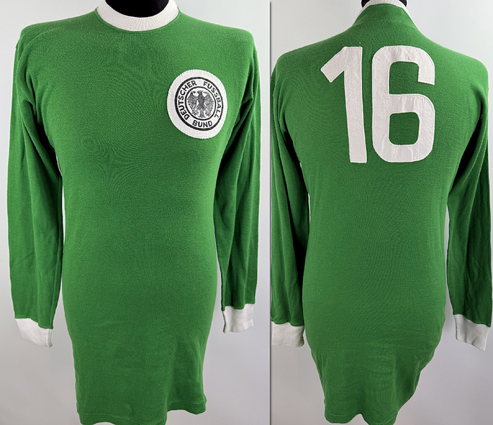  - Original match-worn player shirt of the B-National Team, featuring the number 16, from the 1967/1968 international season. Long-sleeved; manufactured by Umbro. Sourced from the collection of a former DFB (German Football Association) team bus driver. Status: ABA. shirt: Long-sleeved; Size M; Embroidered DFB logo; linen back number sewn on; minor signs of storage; shirt shows signs of match wear; 100% Cotton; Made in England; Condition: B. Condition: A