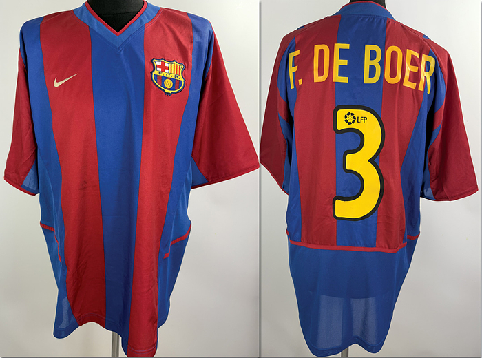  - Original match-worn FC Barcelona player shirt, number 3, belonging to Frank de Boer. Worn during a league match in the 2002/2003 season. The shirt originates from the collection of a former DFB (German Football Association) employee. Status: ABB. Short-sleeve shirt; Size L; Embroidered Barcelona crest; Embroidered Nike manufacturer logo; Heat-pressed player name and number; 100% Polyester; Made in Thailand. Condition: A