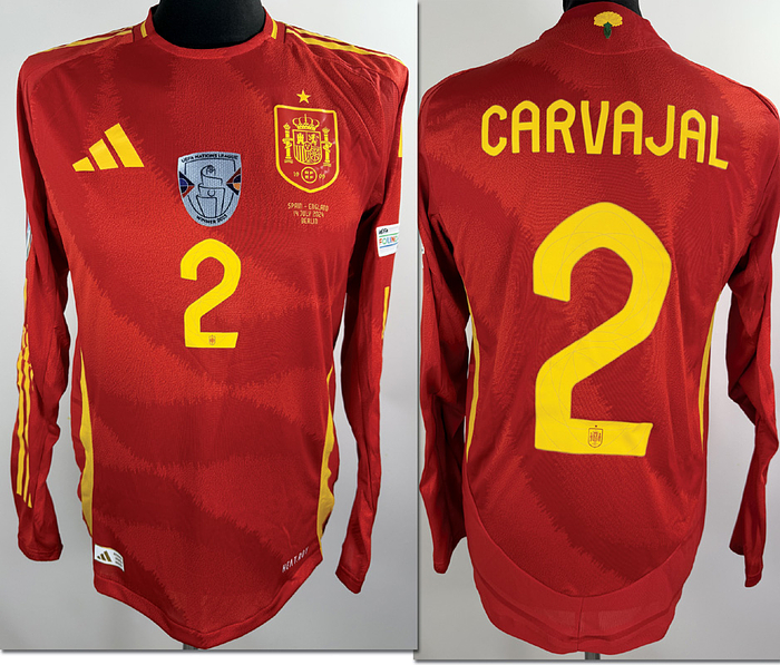  - Original match-issued Spain player shirt (No. 2) belonging to Daniel Carvajal, prepared for the European Championship Final on July 14, 2024, in Berlin. Status: AAB. Long-sleeve shirt; Size M; Club crest and Adidas manufacturer logo applied; Player number and name applied in rubberized print; Match details applied in rubberized print; "European Champions" patch applied in flock print; Foundation patch applied in flock print; 100% Polyester; Made in Cambodia. --The jersey comes from the collection of a DFB official who received it after the match. Condition: A